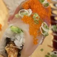 Sunset · Spicy. Spicy tuna, shrimp tempura top with avocado 4 types of sashimi sauce & tobiko