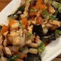 Sushi Taco · (4 pcs crisp seaweed, top w/ assorted sashimi, onion, tomato, jaapeno, tobiko, green onion &...