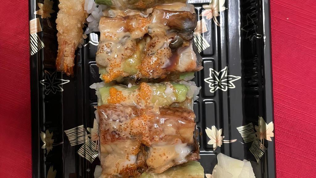 Dragon Roll · Inside: Shrimp, Cucumber / Outside: Unagi, Avocado / Sauce: Unagi Sauce, Spicy Mayo, Creamy Sauce / Topping: Masago.