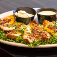 Potato Skins · Jack and cheddar cheese, bacon bits, chives.