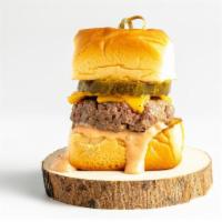 Impossible Slider · Impossible cheese burger, secrete sauce, pickle on a hawaiian roll.
