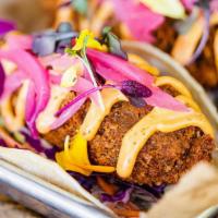 Avocado Tacos · Deep fried beer battered avocados, chipotle cabbage slaw, pickled red onion, micro greens. *...