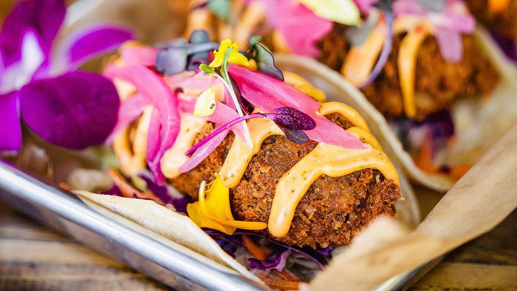 Avocado Tacos · Deep fried beer battered avocados, chipotle cabbage slaw, pickled red onion, micro greens. *Vegan