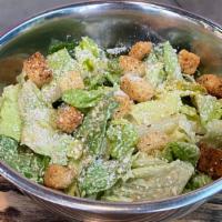 Caeser Salad Vegan · Chopped romaine lettuce, sourdough croutons, parmesan cheese, shredded carrots, Caesar dress...
