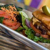 Classic Burger · Cheddar cheese, lettuce, tomato, red onion, remoulade sauce, sesame seed bun. Served with a ...