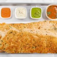 Rava Onion Dosa · Cracked wheat crepe with onions and spices.