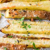 Truffle Fries · Our Crispy straight cut fries with truffle oil, truffle zest & fried parsley