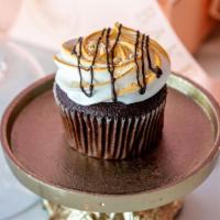 S'Mores Cupcake · Chocolate cupcake topped with our in house marshmallow frosting graham crackers and dark cho...