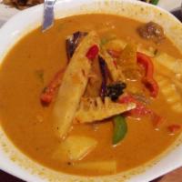 Red Curry · Spicy. Sliced meat in red curry paste with bamboo shoots, eggplant, green bean, bell pepper,...