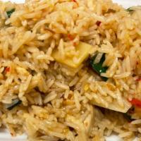 Basil Fried Rice · Pan-fried rice with bell pepper, onion, bamboo, and Thai basil leaves in garlic sauce.