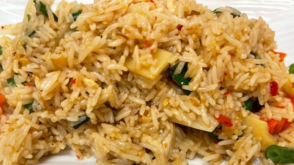 Basil Fried Rice · Pan-fried rice with bell pepper, onion, bamboo, and Thai basil leaves in garlic sauce.