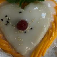 Sweet Sticky Rice With Mango · topped with coconut milk and sesame seeds