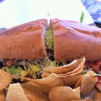 Tortas (Mexican Sandwich) · Served with charbroiled steak, chicken, or al pastor on a grilled Mexican bun, with beans ch...