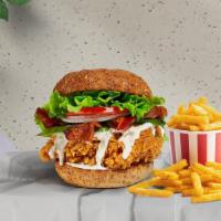 The Blt Fried Chicken Sandwich · Crispy fried chicken, crispy bacon, lettuce, onion, tomatoes, and house mayo. Served on a br...