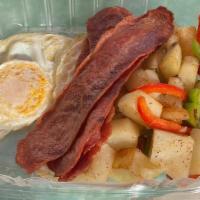 Two Eggs Any Style · served with bacon, ham or sausage, choice of bagel or toast & choice of potatoes, tomatoes, ...