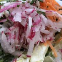 Cabbage Salad · Crisp and refreshing. Freshly cut cabbage seasoned with lemon juice, olive oil, and our spec...