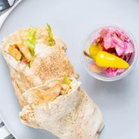 Chicken Shawarma · Marinated chicken breast wrapped with ripe tomatoes, crisp lettuce, and our signature garlic...