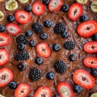 Nutella Orgasm · Desert Nutella pizza topped with strawberries, blackberries and banana.