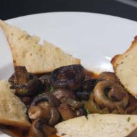 Spicy Sautéed Mushrooms · Slow cooked mushrooms sautéed with cilantro,. jalapeños, paprika, and garlic butter in a whi...