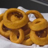 Onion Rings · Crispy beer battered onion rings fried to a golden brown.