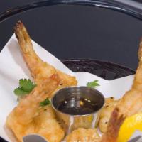 Tempura Shrimp · Lightly battered shrimp served with sweet and sour and ponzu sauce.