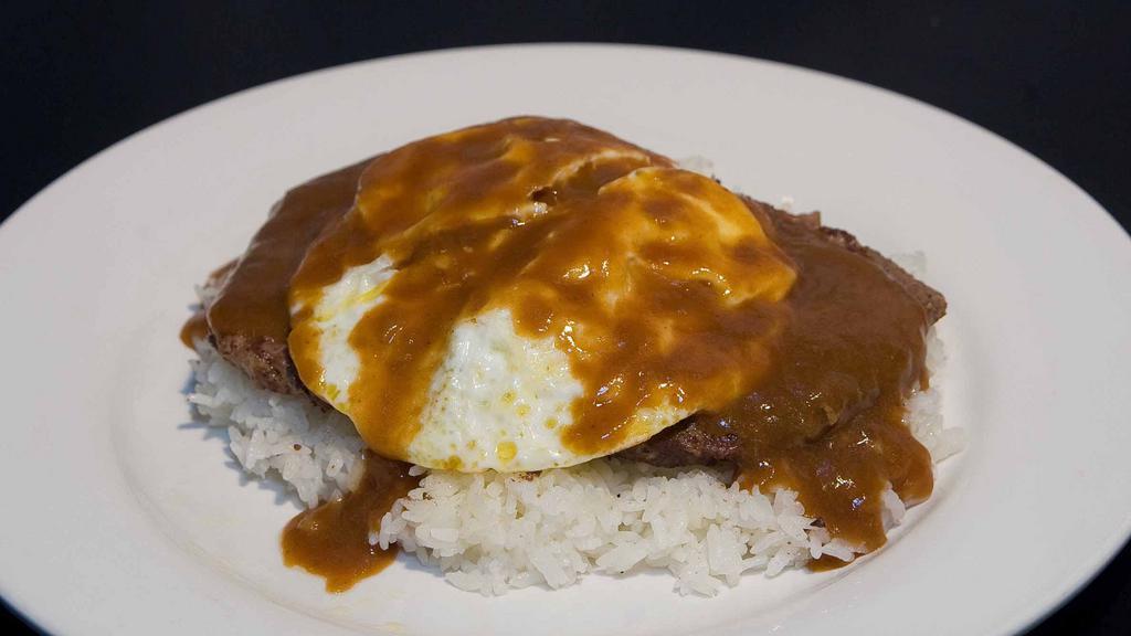 Loco Moco · A Hawaiian favorite! Rice topped with two 100% ground beef patties, two eggs cooked over-easy, covered in beef gravy.