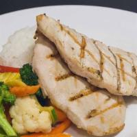 Grilled Chicken Breast Entrée · Two 6 oz. Grilled chicken breasts served with rice and seasoned sautéed vegetables.