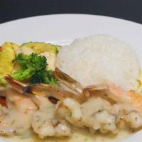 Shrimp Scampi Dinner · Five jumbo shrimp sautéed in garlic, white wine and lemon butter sauce served with rice and ...