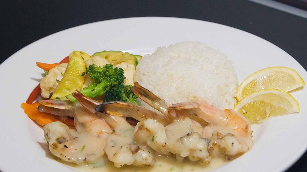 Shrimp Scampi Dinner · Five jumbo shrimp sautéed in garlic, white wine and lemon butter sauce served with rice and seasoned sautéed vegetables.