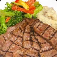 Tri-Tip Dinner · 10 oz. House cured tri-tip, thinly sliced, served with roasted garlic mashed potatoes.