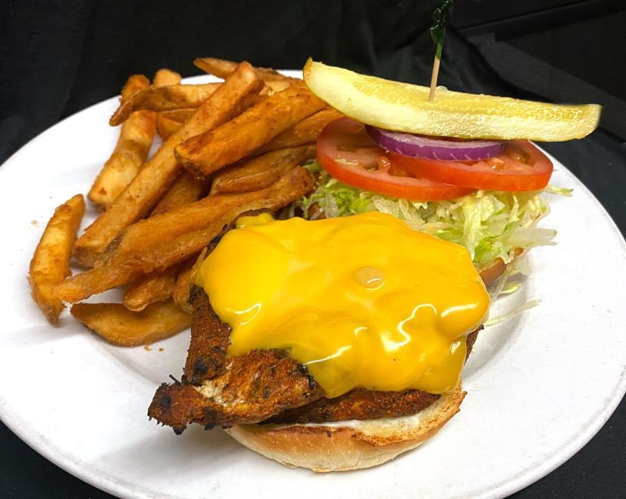Cajun Chicken Sandwich · Grilled chicken breast with Cajun seasoning, topped with American cheese, mayonnaise, and served on a gourmet bun.