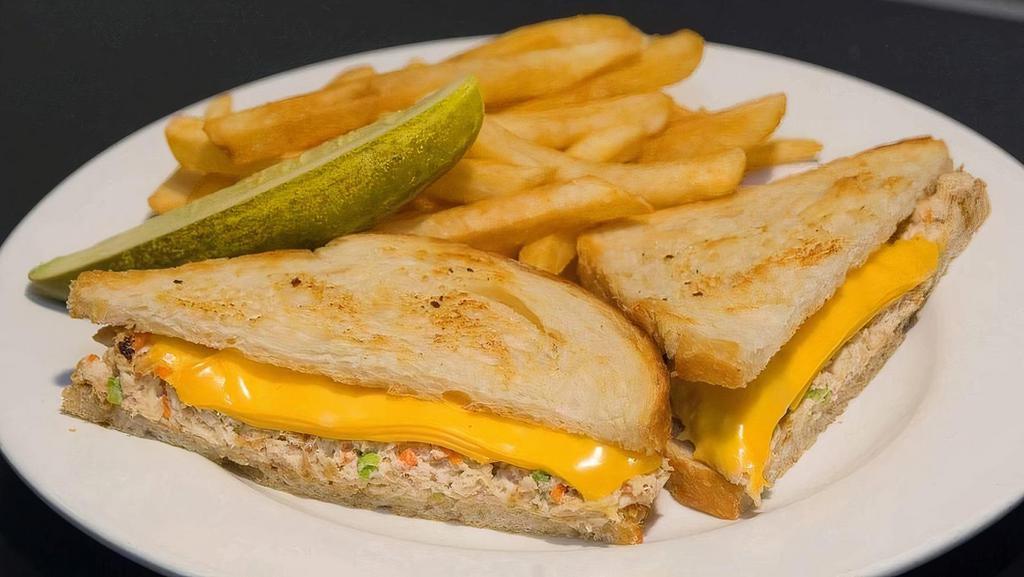 Tuna Melt Sandwich · Albacore tuna salad melted with American cheese on sourdough bread.