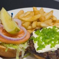 Jalapeño And Cream Cheese Burger · Topped with jalapeños and a thick-cut slice of cream cheese
