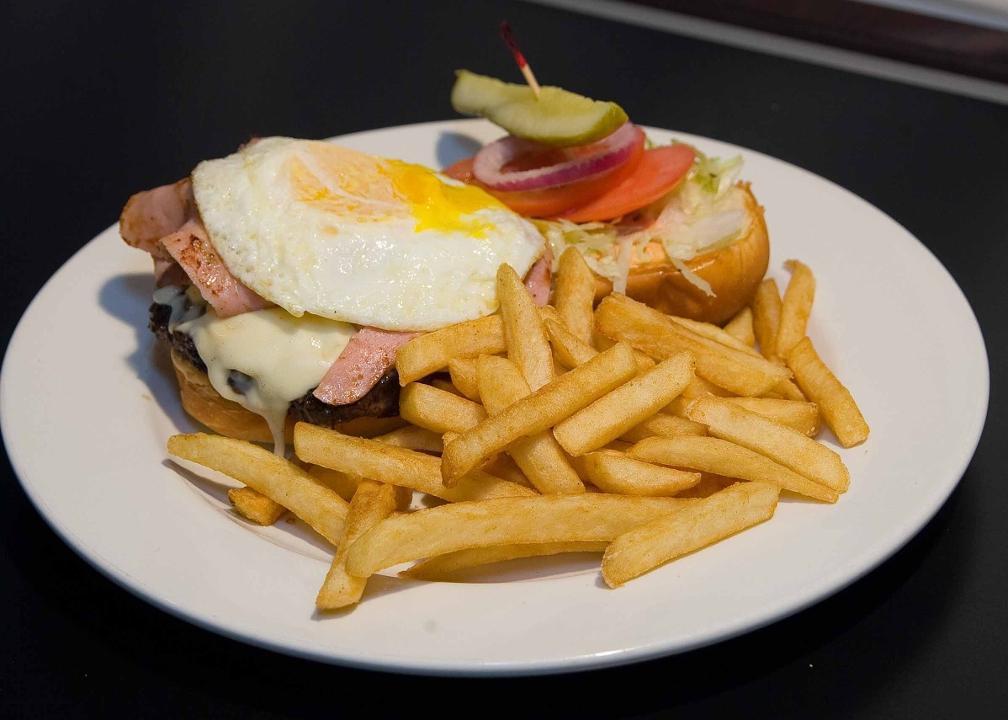 Ham And Egg Burger · Topped with pepper jack cheese, a fried egg, thinly sliced ham, and chipotle mayo.