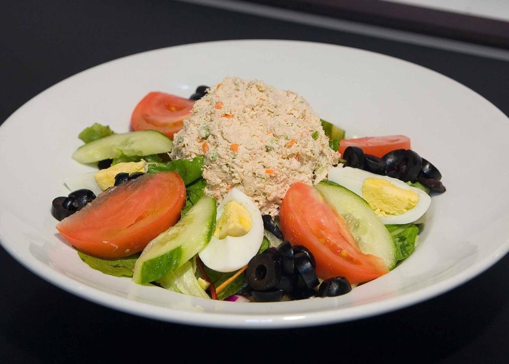 Tuna Salad · White albacore tuna salad served with a. hardboiled egg, cucumbers, tomatoes, and black. olives over a bed of mixed greens.
