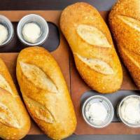 Four Pack Of Bread · Four loaves of our famous, hot, fresh baked bread.