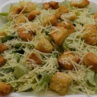 Caesar Salad · Crisp iceberg lettuce tossed with croutons, Caesar dressing, and grated cheese.