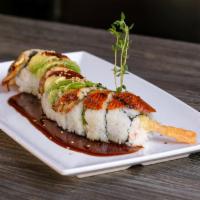 Dragon Roll · In: shrimp tempura, masago, cucumber, avocado, and imitation crab. Top: eel and avocado.