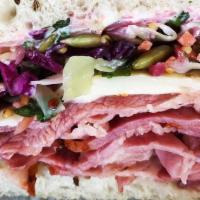 Seedy Pastrami · Pastrami, melted swiss, seedy slaw, garlic aioli, and on toasted bread.
