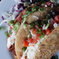 Tacos Dorados · 2 HARD SHELL TACOS SERVED FILLED WITH ORGANIC CHICKEN TINGA OR POTATO/HOMINY MASH. LETTUCE A...