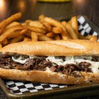 Philly Cheesesteak Sandwich · A full 1/2 pound of thinly sliced rib eye, grilled up Philly style with onions, and provolon...