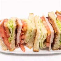 Turkey Club · Turkey, Mozzarella cheese, Bacon, Avocado, Tomatoes, Lettuce and Mayo