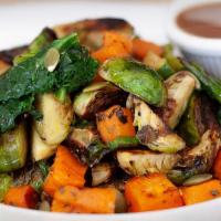 Roasted Veggie Bowl · Farro, sweet potatoes, kale, brussels sprouts, pepitas, ＆ lemon vinaigrette on the side.