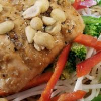 Salmon Asian Noodle · Topped w/ Salmon- Soy-marinated noodles tossed in ginger vinaigrette dressing with broccoli,...