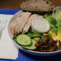 Chef Salad · Turkey, cheddar cheese, bacon, butter lettuce, tomatoes, cucumber, and avocado, and egg with...