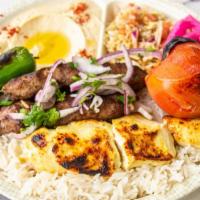 Combo Kabab Plate · Beef luleh and chicken breast kababs, served with rice, roasted tomatoes, pepper, cabbage sa...