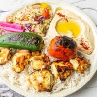 Chicken Kabab Plate · Marinated chicken breast served with rice, roasted tomato and pepper, hummus, cabbage salad,...