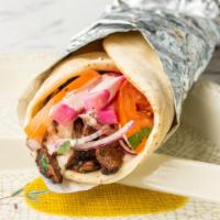 Beef Shawarma Wrap · Served with marinated beef shawarma strips wrapped in pita bread with tomatoes, lettuce, oni...