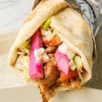 Chicken Shawarma Wrap · Marinated chicken shawarma strips wrapped in pita bread with tomatoes, lettuce, and garlic s...