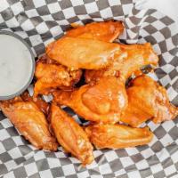 Buffalo Wings · Tossed in buffalo sauce and served with blue cheese dressing.